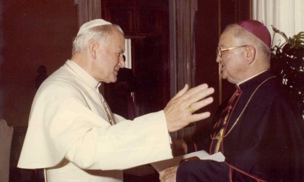 Bishop James Hogan, right, and Pope John Paul II in Rome.
