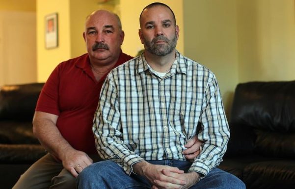 Matthew Barrett (right) says his job offer at Fontbonne Academy in Milton, Massachusetts, was rescinded when he listed his husband as an emergency contact.