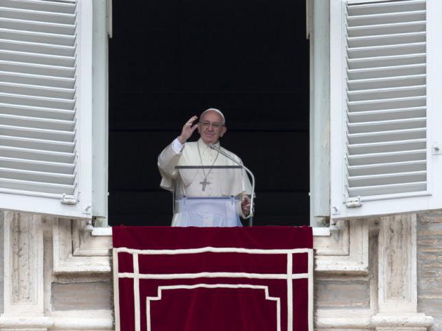 Pope Francis delivers his blessing during the Regina Coeli prayer from his studio's window overlooking St. Peter's Square, at the Vatican