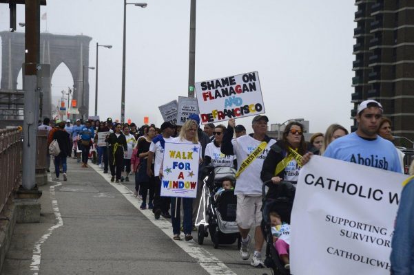Advocates for children marched across Brooklyn Bridge to urge pols to change the state's kid-rape law.