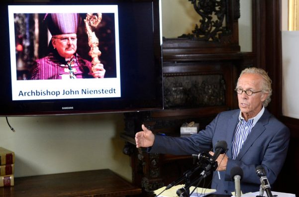 Jeff Anderson, a lawyer for victims of clergy abuse, with a photo of Archbishop John C. Nienstedt of St. Paul and Minneapolis.
