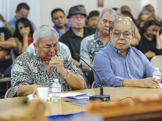 Leo Tudela, 73, pulls off his eyeglasses as he is overcome with emotions during his testimony in support of Bill 326 at the Guam Legislature in Hagatna on Monday, Aug. 1. Tudela testified that as a child, he served as an altar boy with the Mount Carmel Church in Chalan Kanoa, Saipan until he was given the opportunity to attend Catholic school on Guam. Tudela told lawmakers during his testimony that he was sexually abused by three members of Guam's Catholic Church, including a priest, on three different occasions.